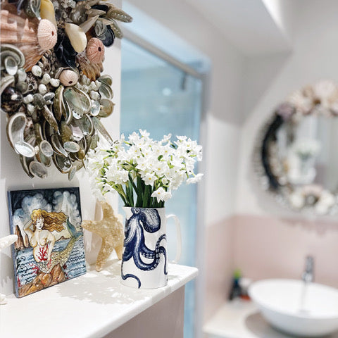 A blush pink coastal inspired shell Cornish bathroom