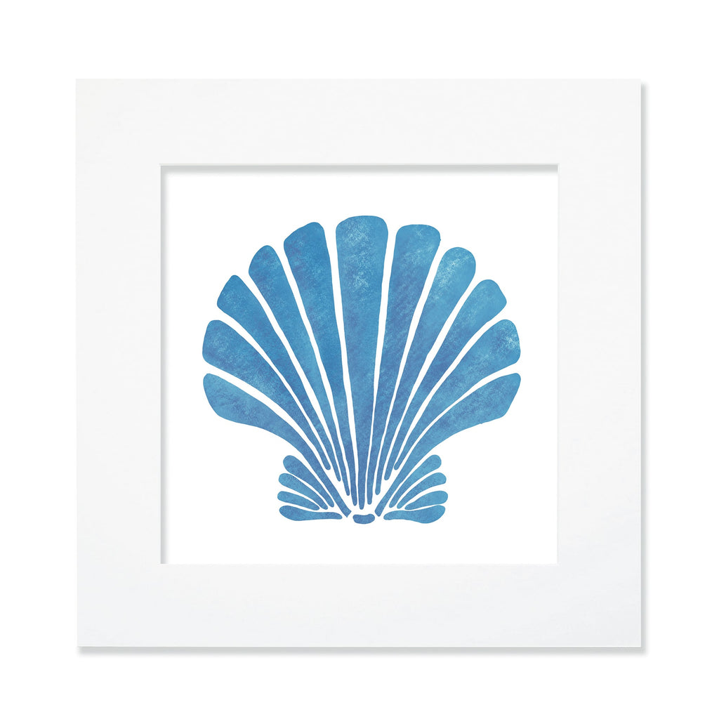 A 30cm mounted coastal-themed artwork featuring a bold blue scallop shell illustration with a textured finish. The artwork is set in a white frame with a wide mount, highlighting the marine-inspired design in deep blue tones for a striking oceanic aesthetic.