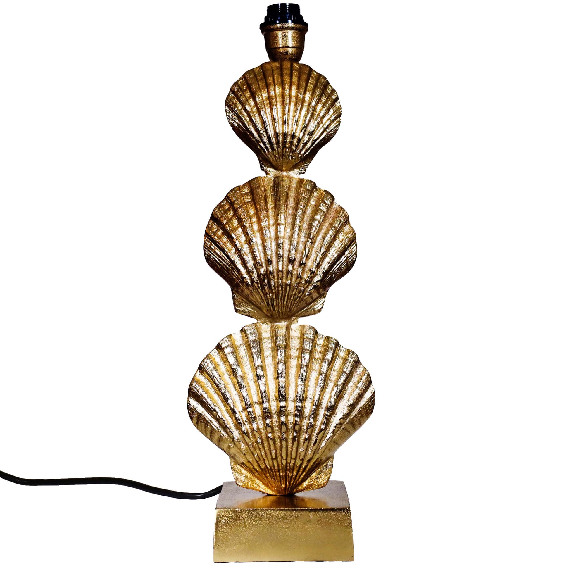 Gold shell-shaped table lamp on a white background