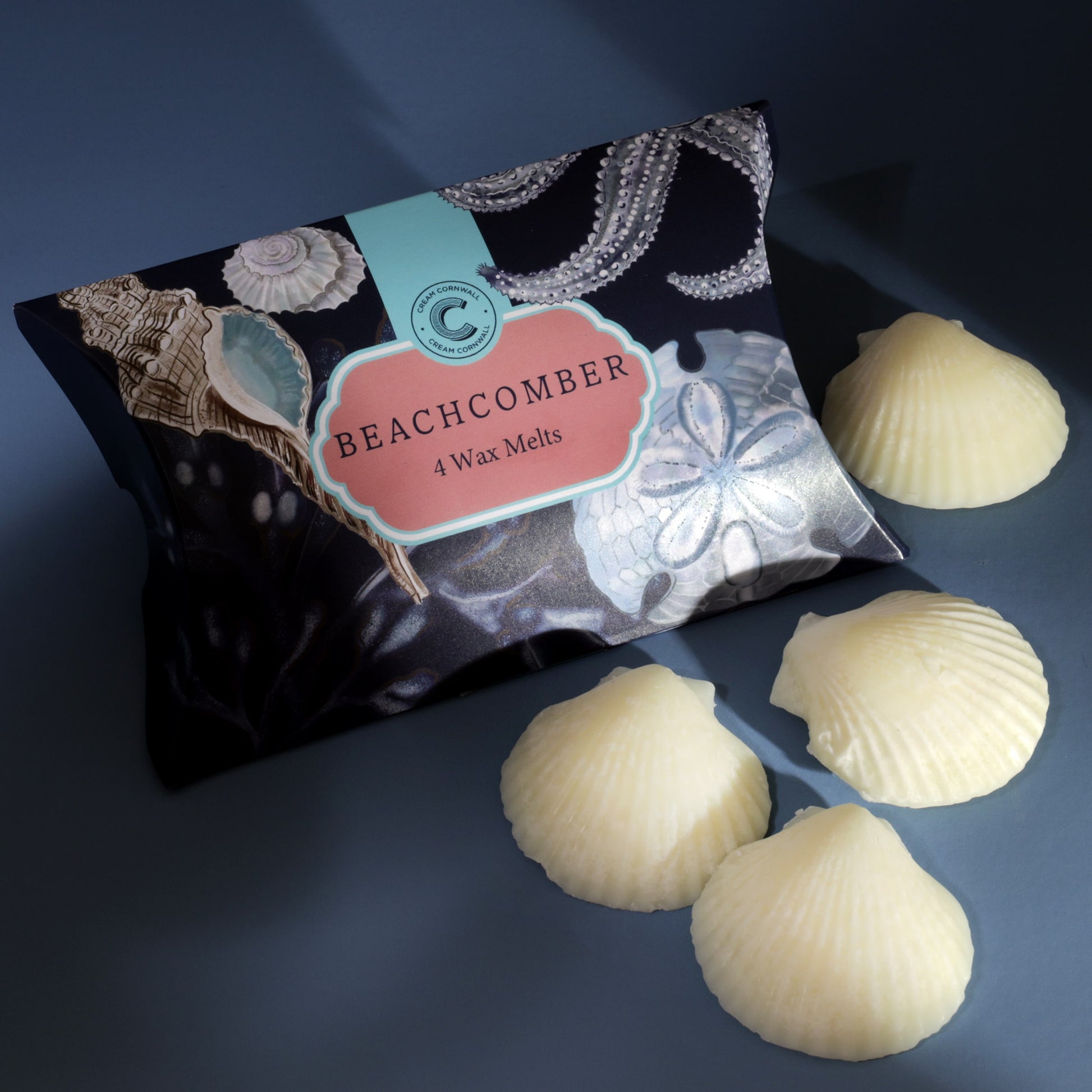 Pack of Beachcomber wax melts with shell-shaped melts on a dark background