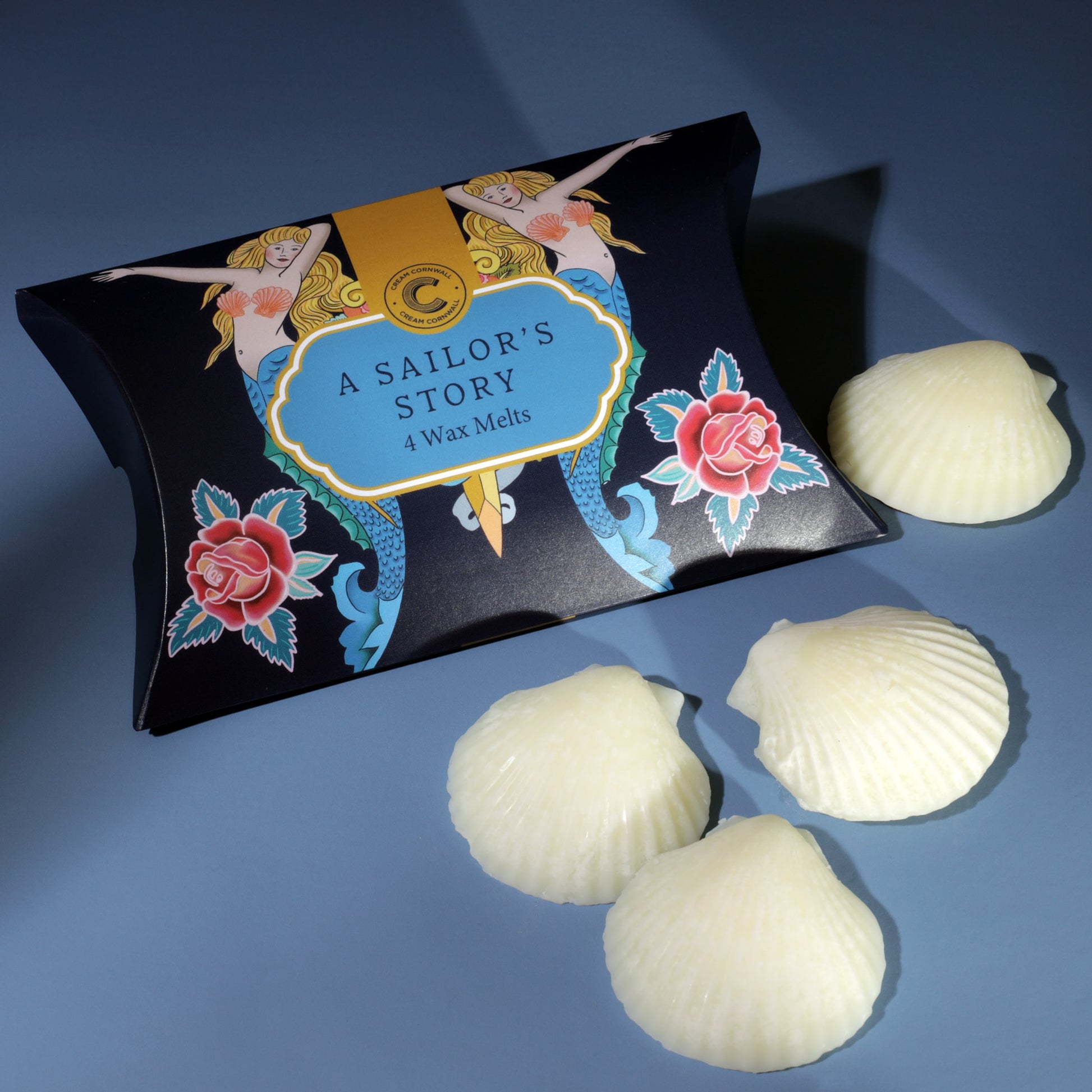 Pack of 'A Sailor's Story' wax melts with decorative packaging on a blue background