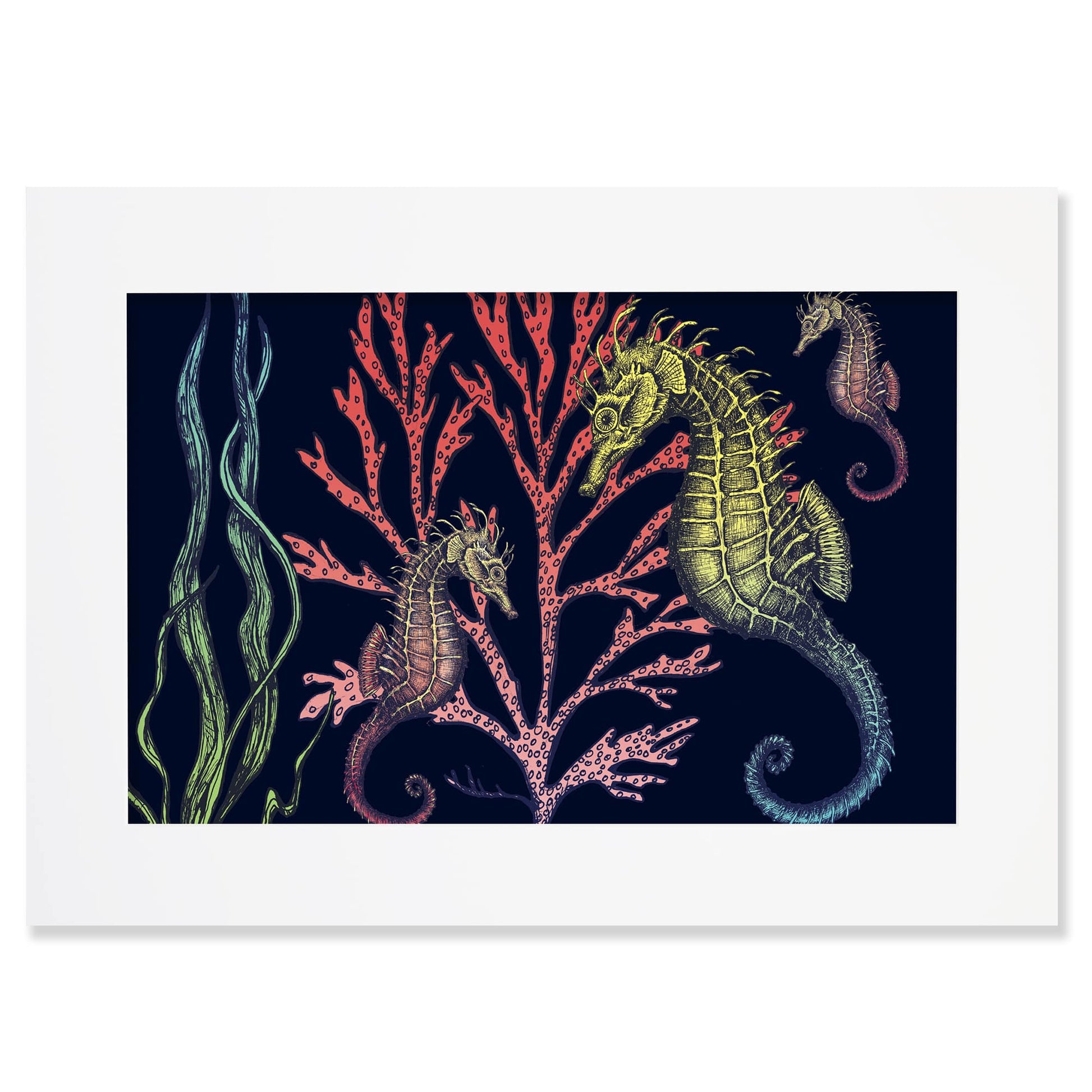 An A2 framed art print featuring an intricate underwater illustration of three seahorses with detailed, textured bodies in shades of green, gold, and red. They are set against a dark navy background, swimming among vibrant coral in pink and red tones, alongside flowing strands of seaweed. The illustration is rich in detail, creating a whimsical and nature-inspired ocean scene.