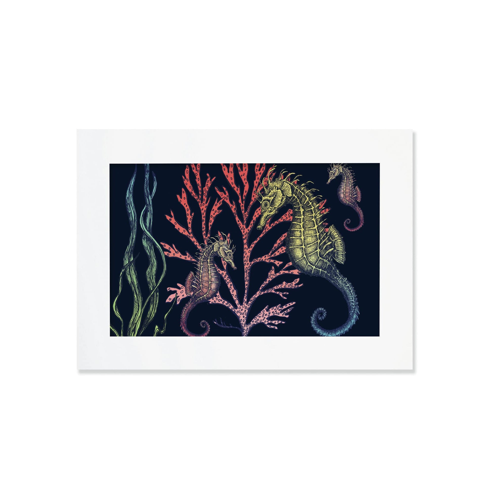 An A4 framed art print featuring an intricate underwater illustration of three seahorses with detailed, textured bodies in shades of green, gold, and red. They are set against a dark navy background, swimming among vibrant coral in pink and red tones, alongside flowing strands of seaweed. The illustration is rich in detail, creating a whimsical and nature-inspired ocean scene.