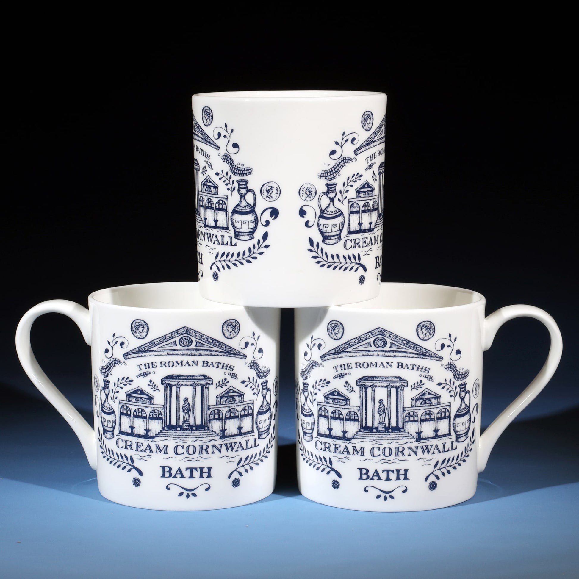 Three Bath mugs on top of each other showing different sides.