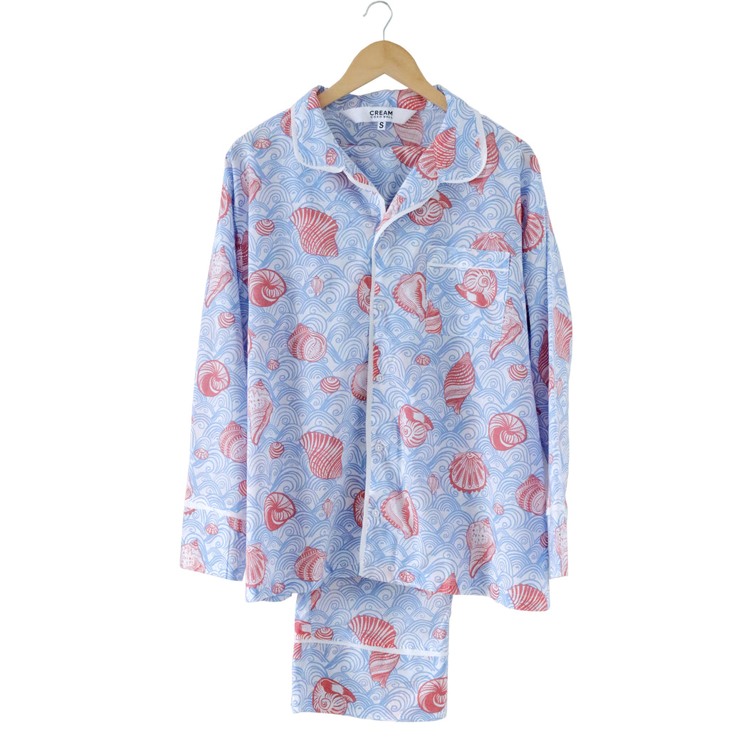 Floral patterned pajama set on a hanger against a white background