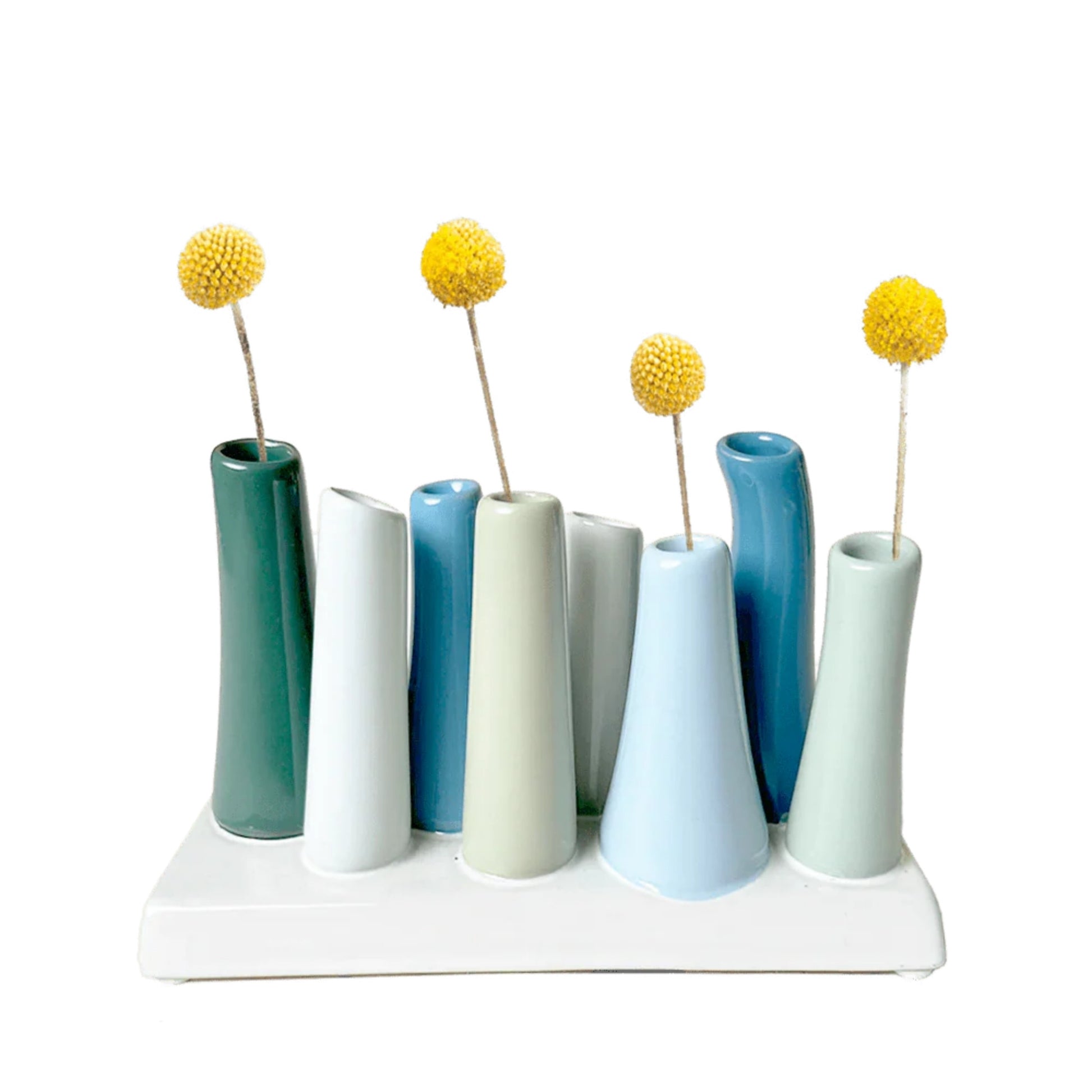 Set of blues ceramic vases with yellow floral arrangements on a white background