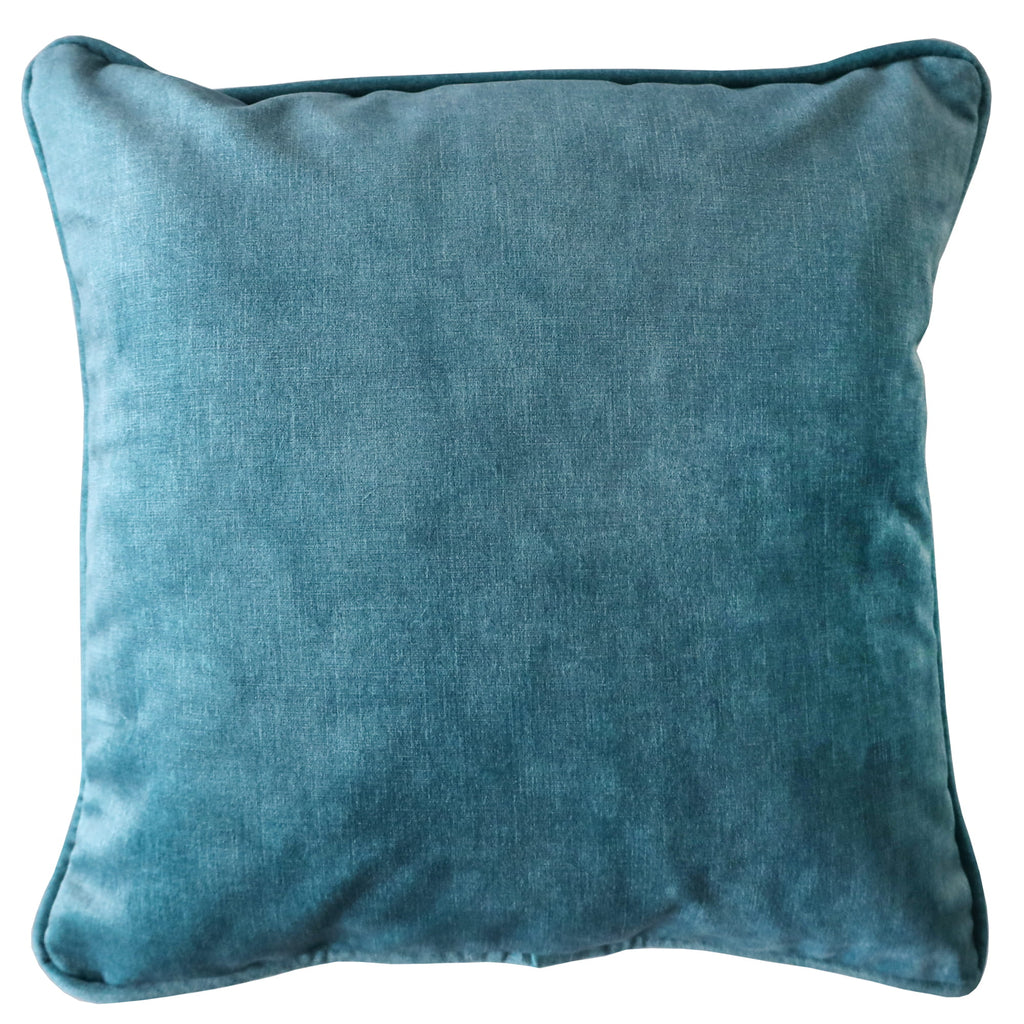 Aqua velvet cushion on white background