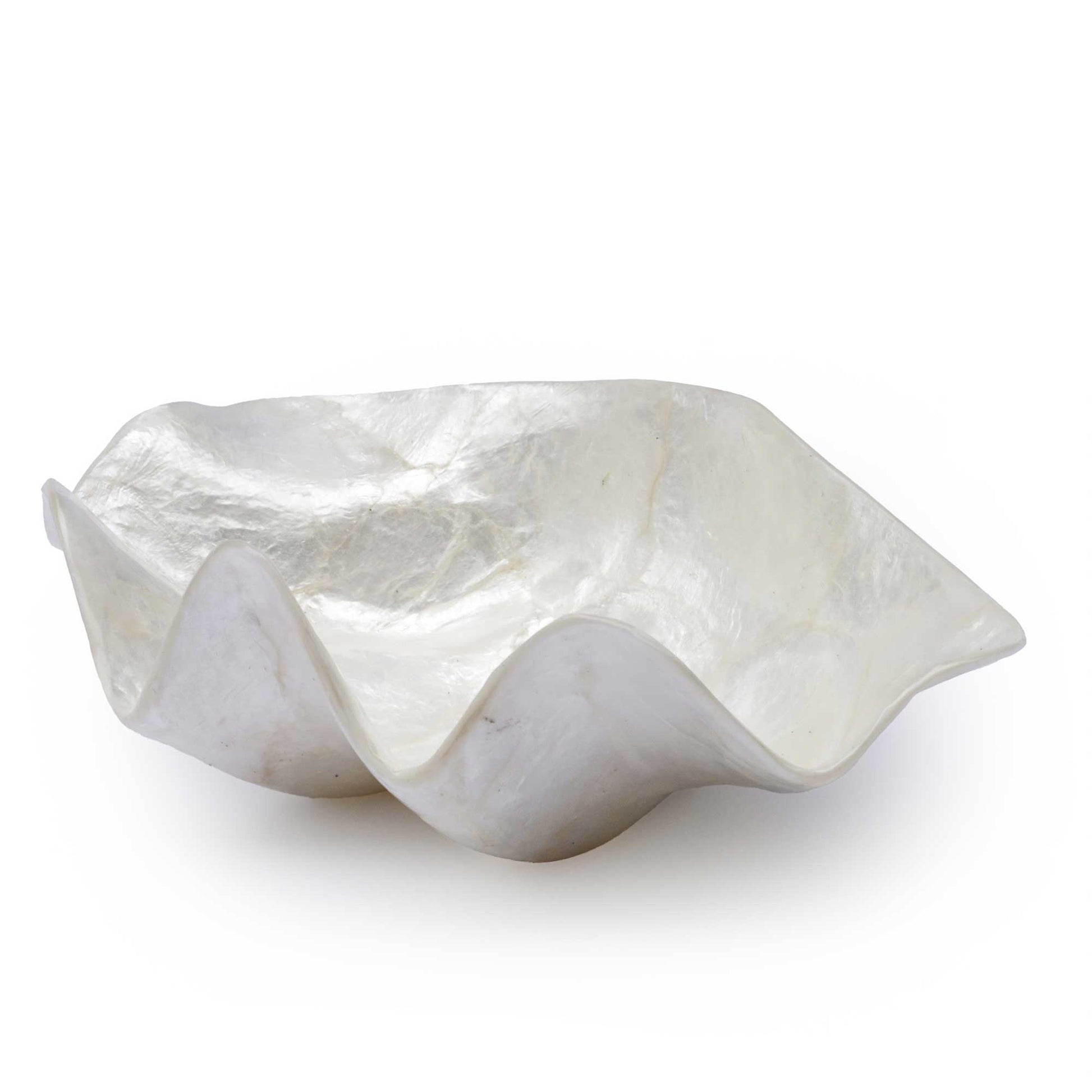 A sculptural, organic-shaped bowl made of polished white mother-of-pearl or shell, featuring wavy, fluted edges and a glossy, iridescent surface, set against a plain white background.