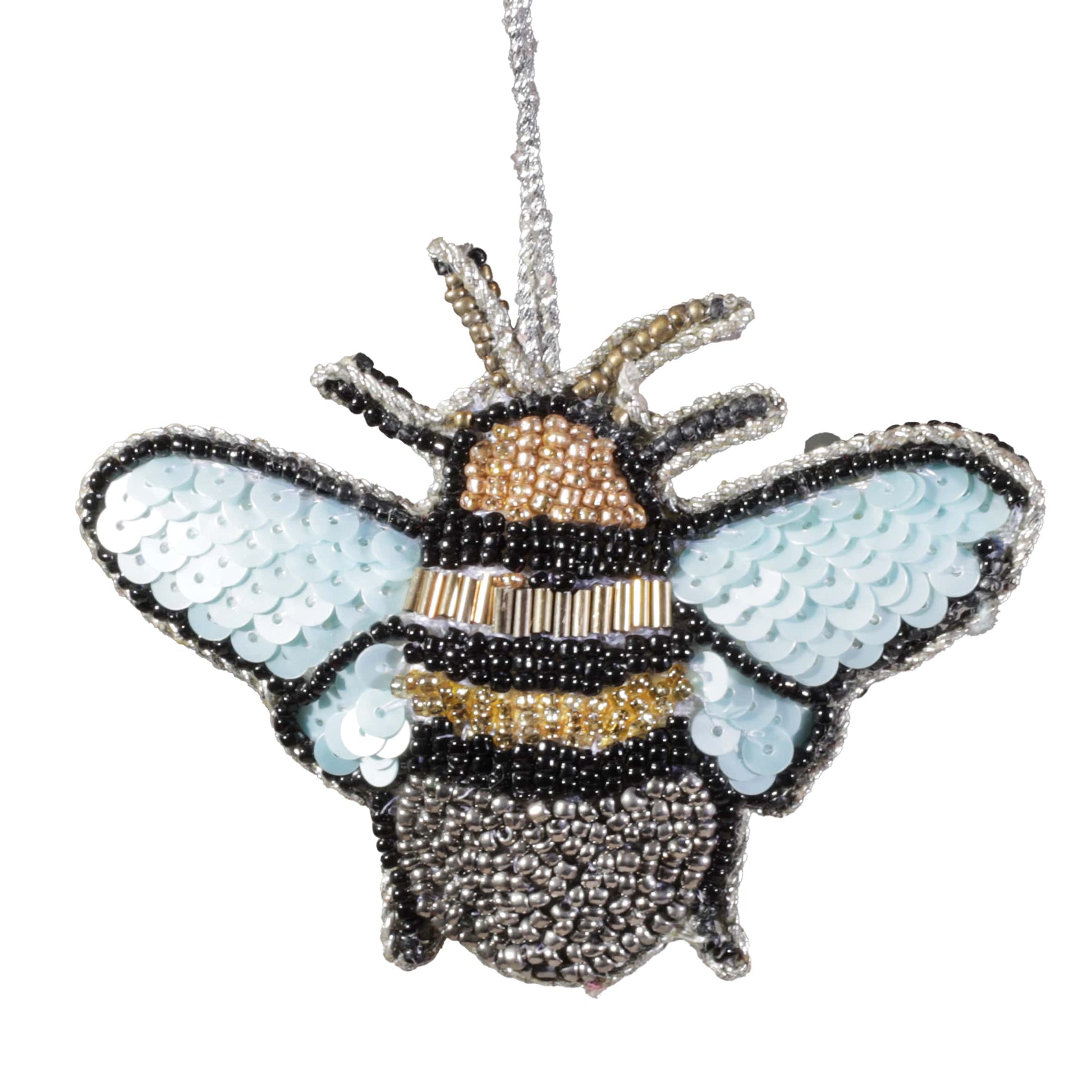 Bee-shaped ornament with sequin wings on a white background