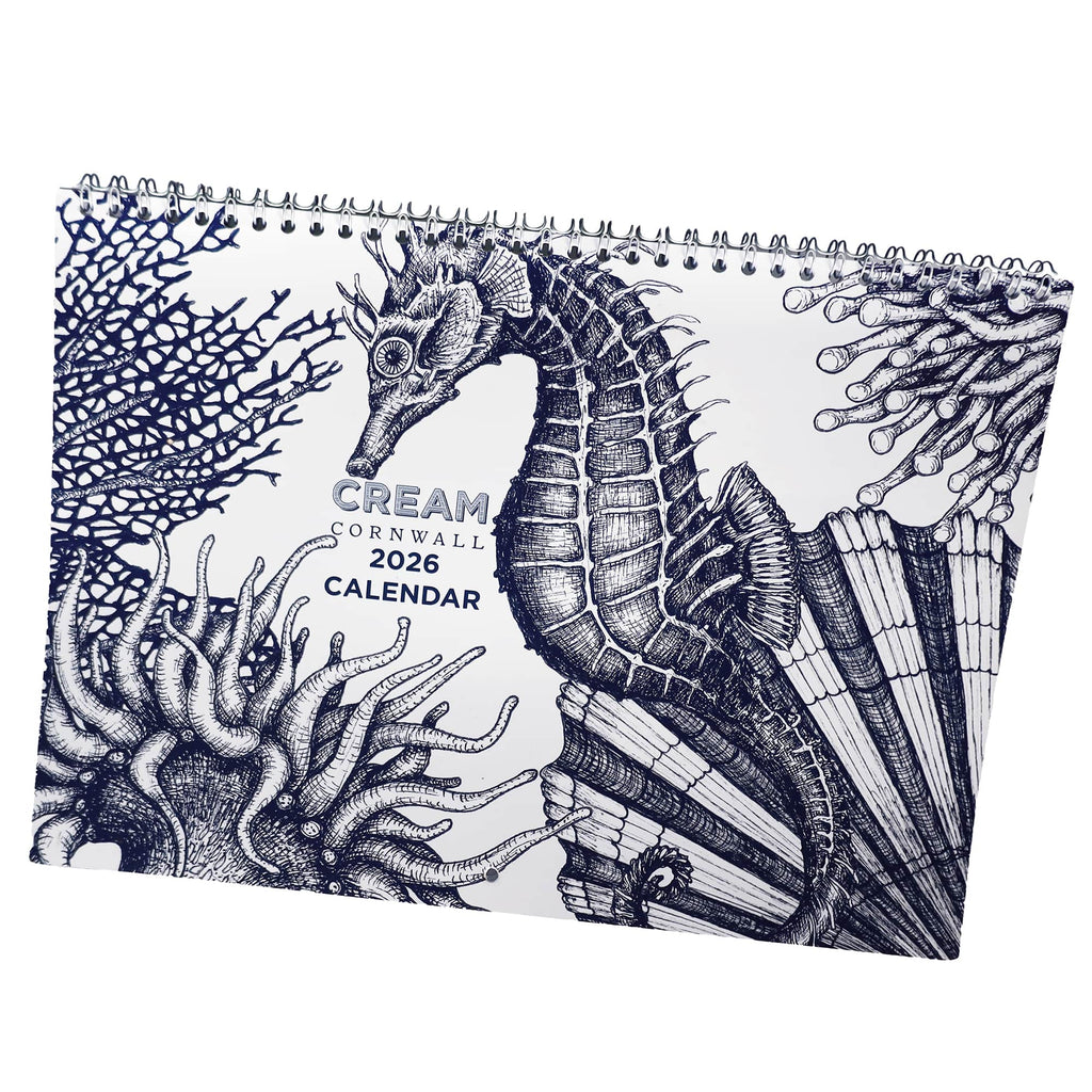 Cream Cornwall 2026 calendar with seahorse and coral illustration on spiral-bound cover.