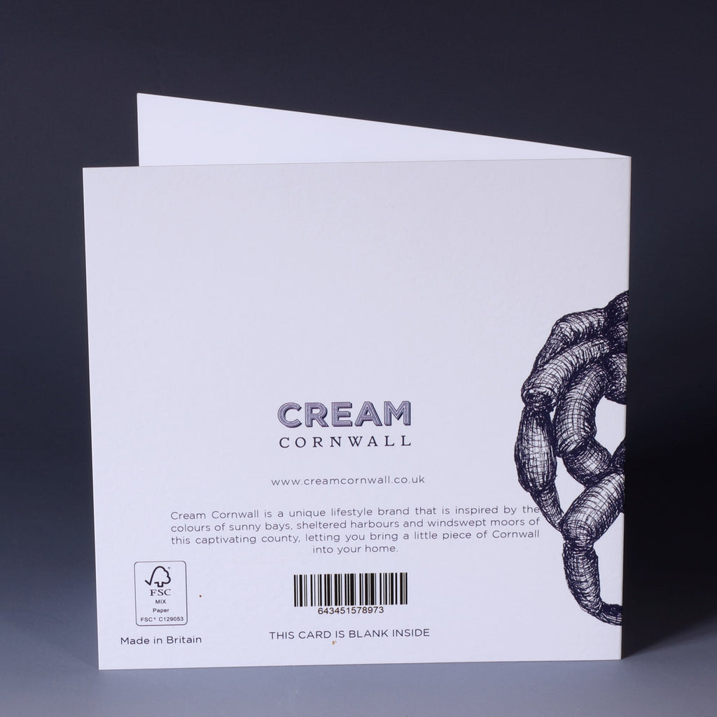 back of greeting card with navy illustrated crab on a white background