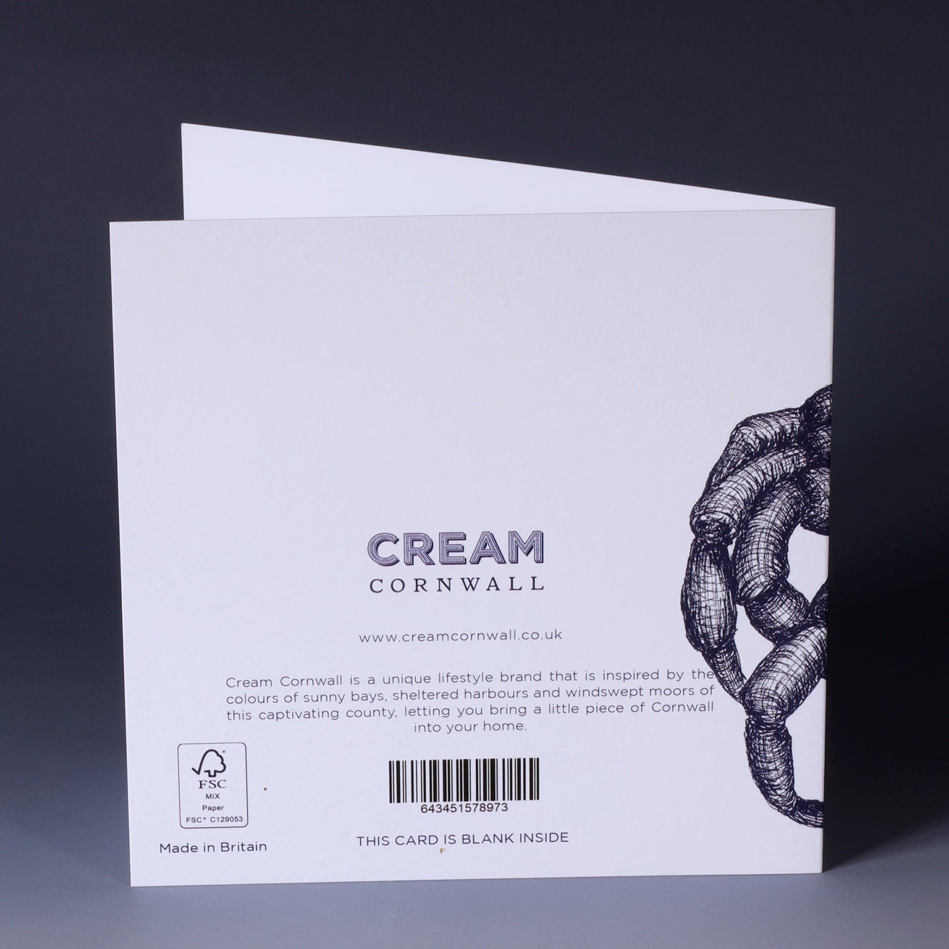 back of greeting card with navy illustrated crab on a white background