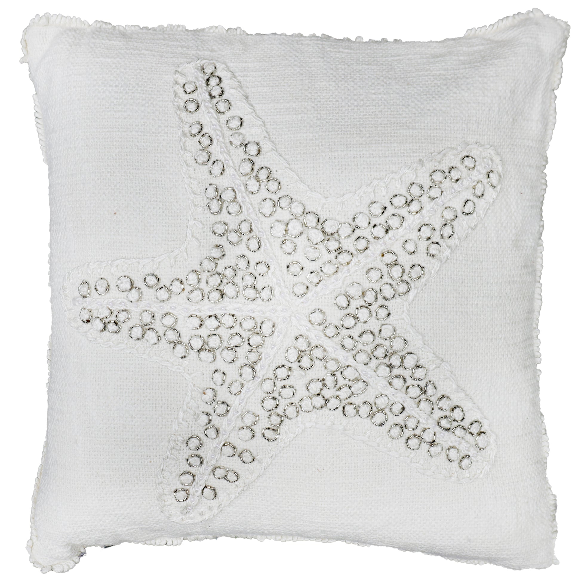 White pillow with a starfish design made of small beads on a white background
