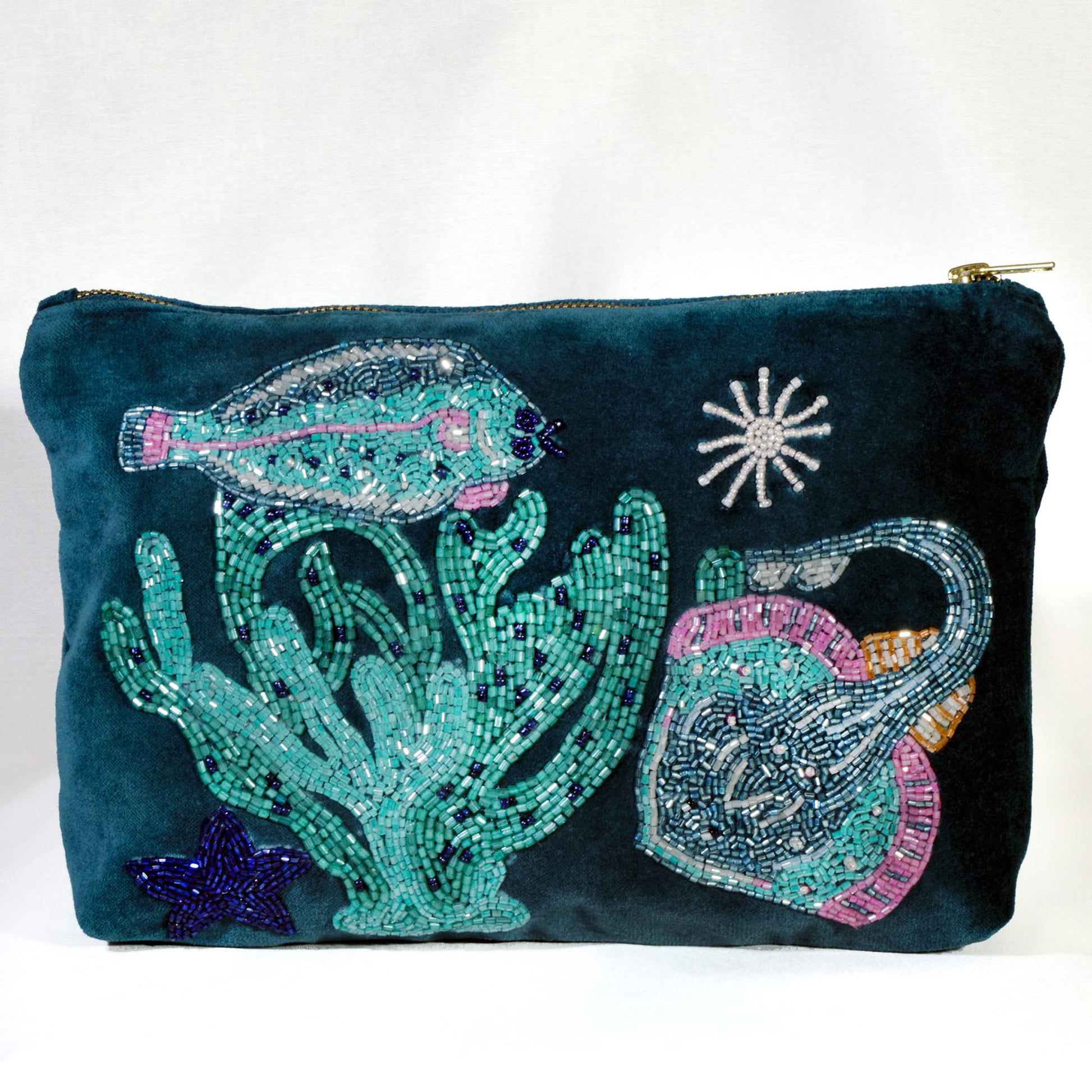 Decorative pouch with underwater-themed embellishments on a white background