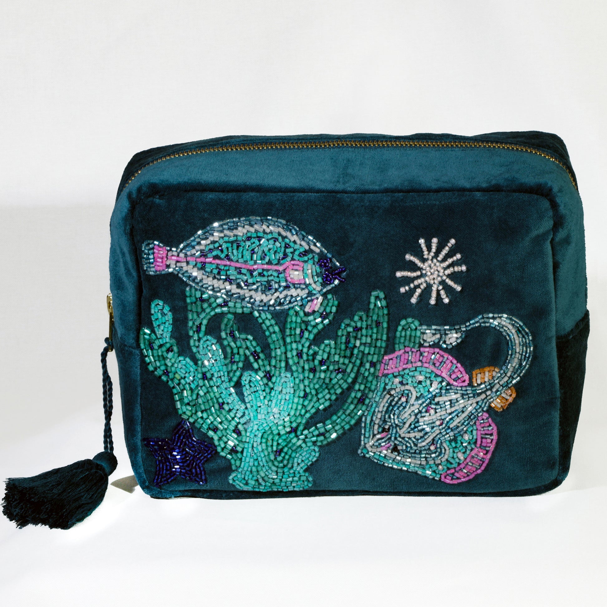 Teal pouch with mermaid-themed embellishments on a white background