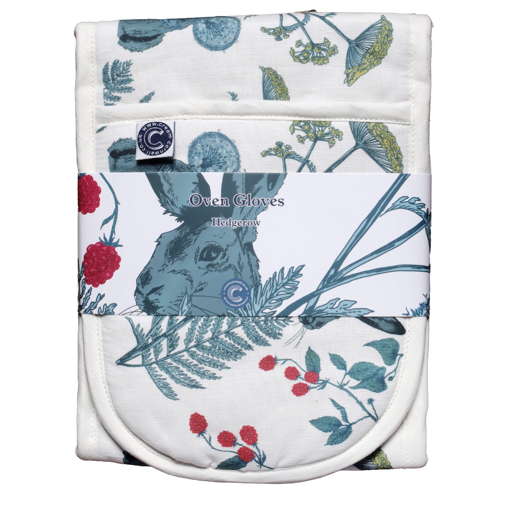 Packaged double oven gloves with a countryside-inspired print of a hare surrounded by wildflowers, ferns, dandelions, and raspberry vines. The gloves are wrapped in a branded label that reads 'Oven Gloves – Hedgerow,' showcasing the rustic nature-themed design in shades of green, red, and yellow on a white background