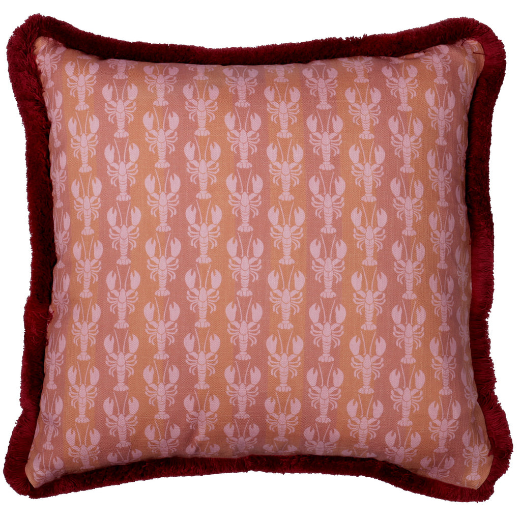 Pillow with lobster pattern and red border on a white background