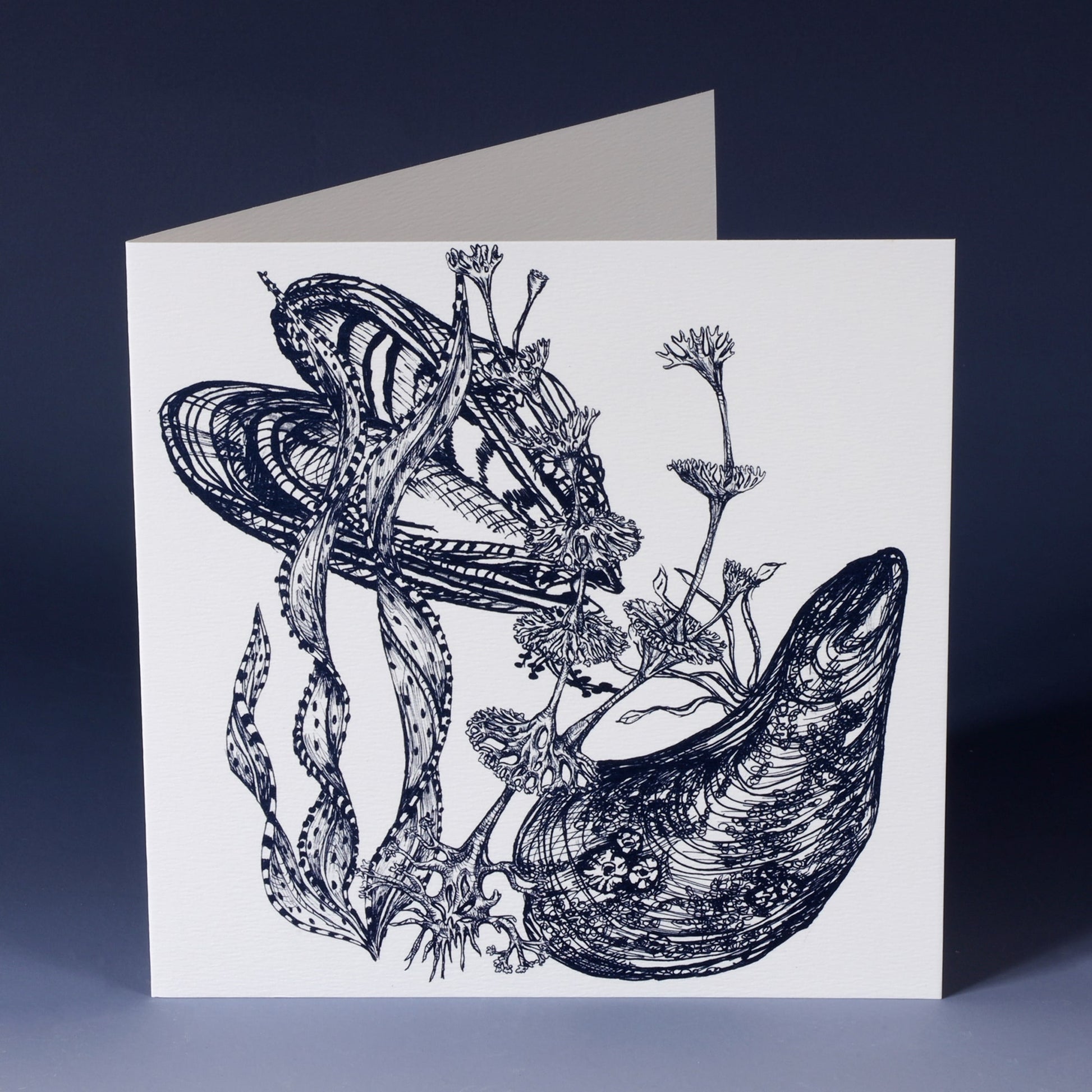 front of white greeting card with navy illustration of mussels and seaweeds standing on an ombre blue backround
