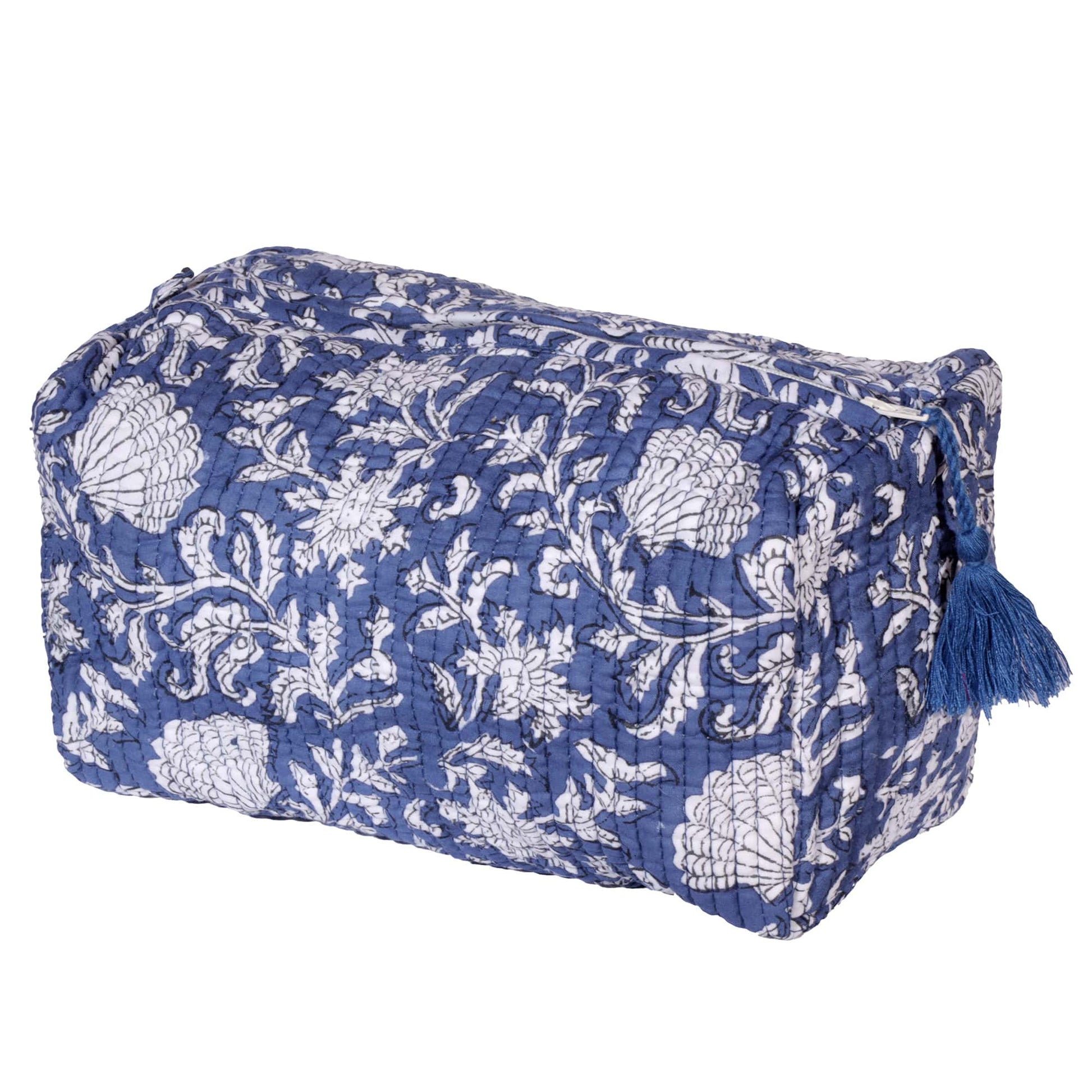 Quilted rectangular pouch with a blue and white floral pattern. The pouch features a zippered top closure adorned with a matching blue tassel, combining style and practicality for storage or travel.