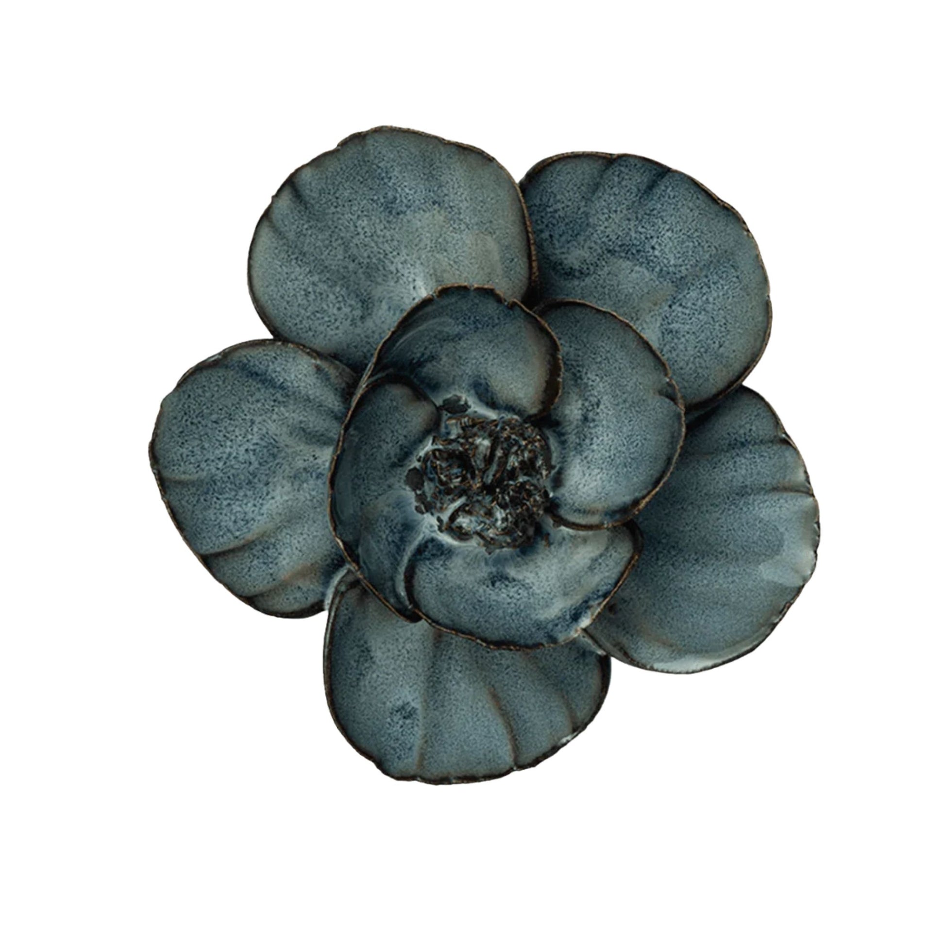 Decorative blue flower-shaped object on a white background
