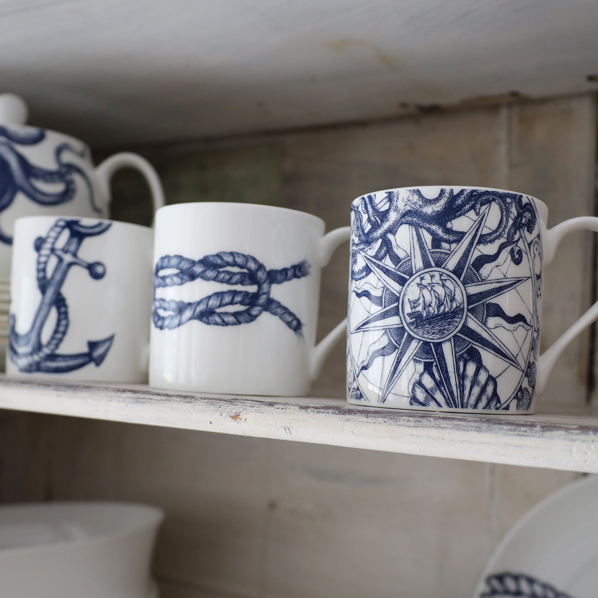 Anchor,Reef Knot and Compass Mug on a whitewashed shelf 