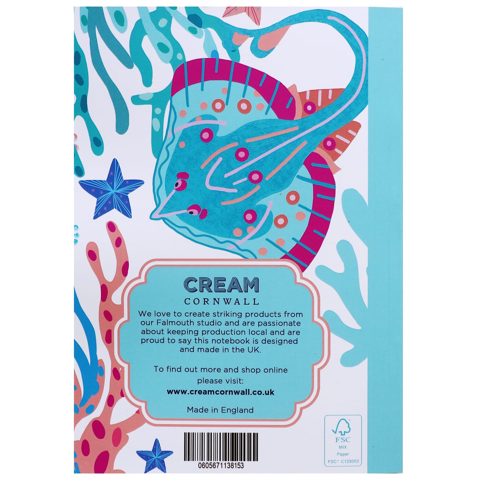 Back cover of a colorful notebook by Cream Cornwall, featuring a bright turquoise and pink skate (ray) surrounded by coral, seaweed, and starfish on a white background. A decorative turquoise label at the bottom center includes text about the brand’s commitment to local production and design in the UK, along with the website and FSC certification.