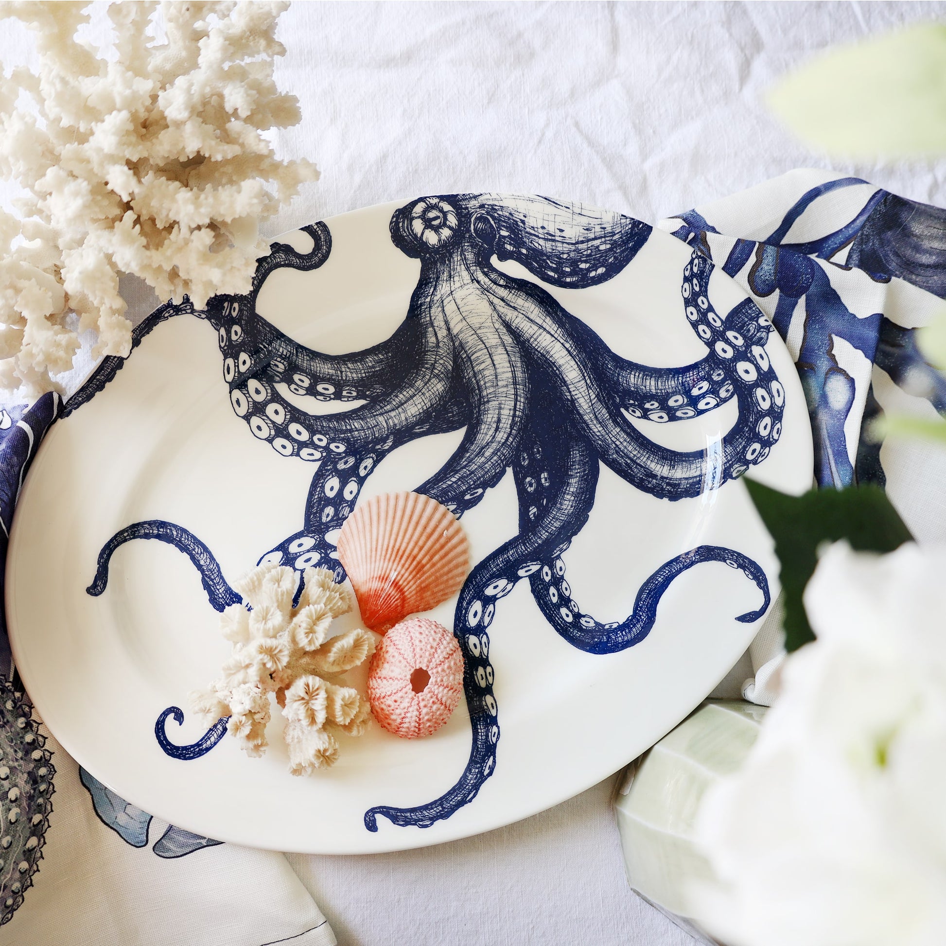 Decorative plate with a blue octopus design on a white background
