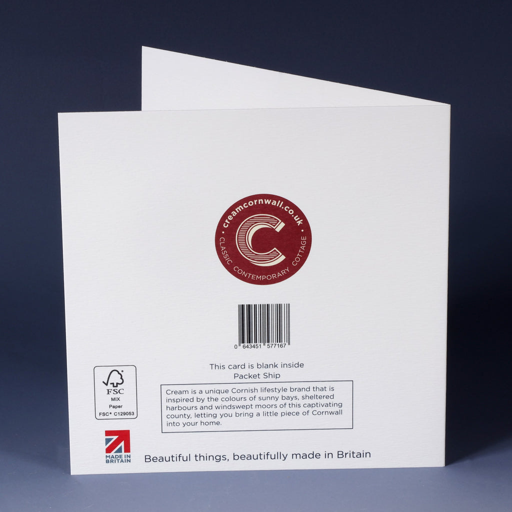 back of front of a white greeting card with a navy illustrated packet ship sailing forwards sitting on an ombre blue background