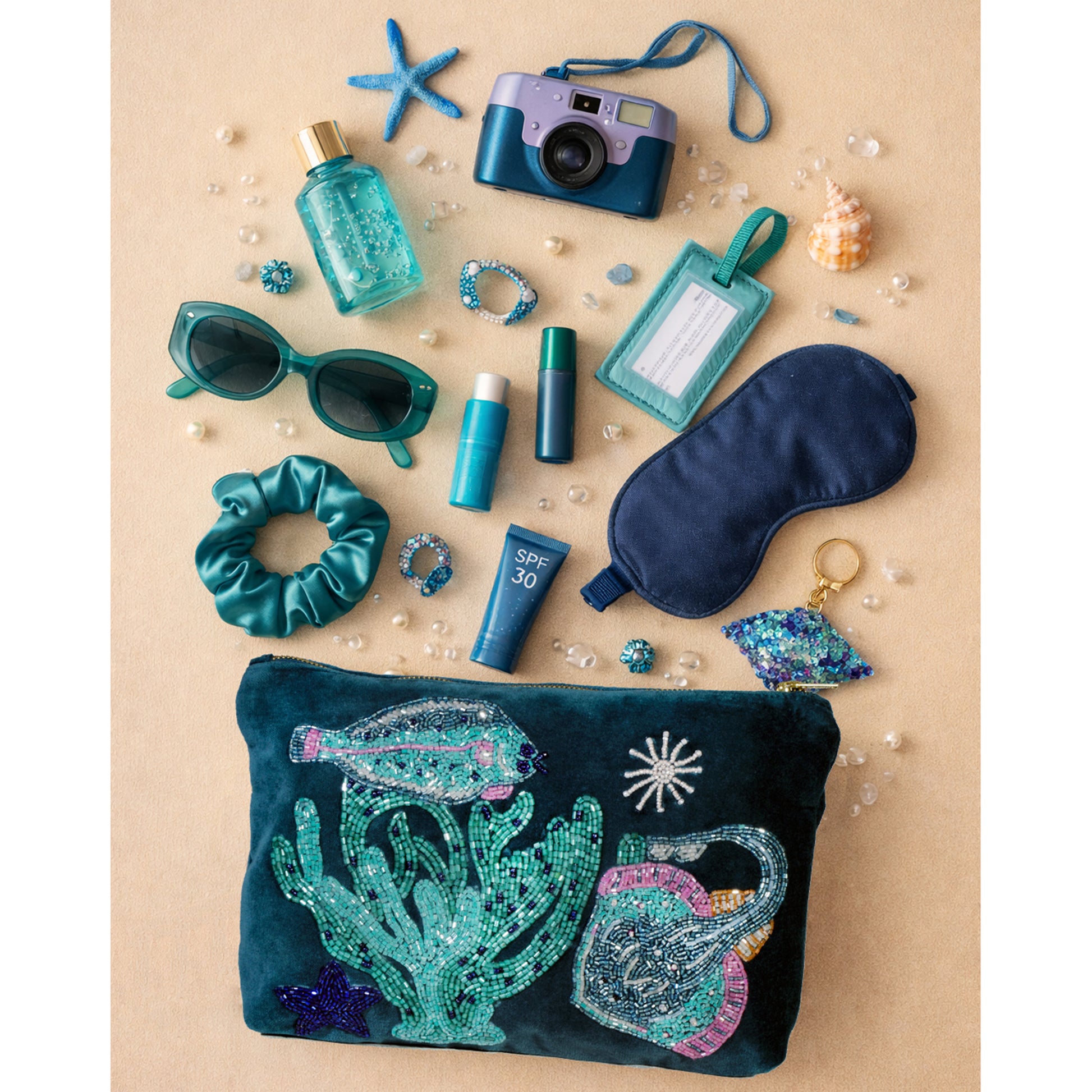 Collection of travel accessories including a pouch, sunglasses, camera, and toiletries on a beige background.