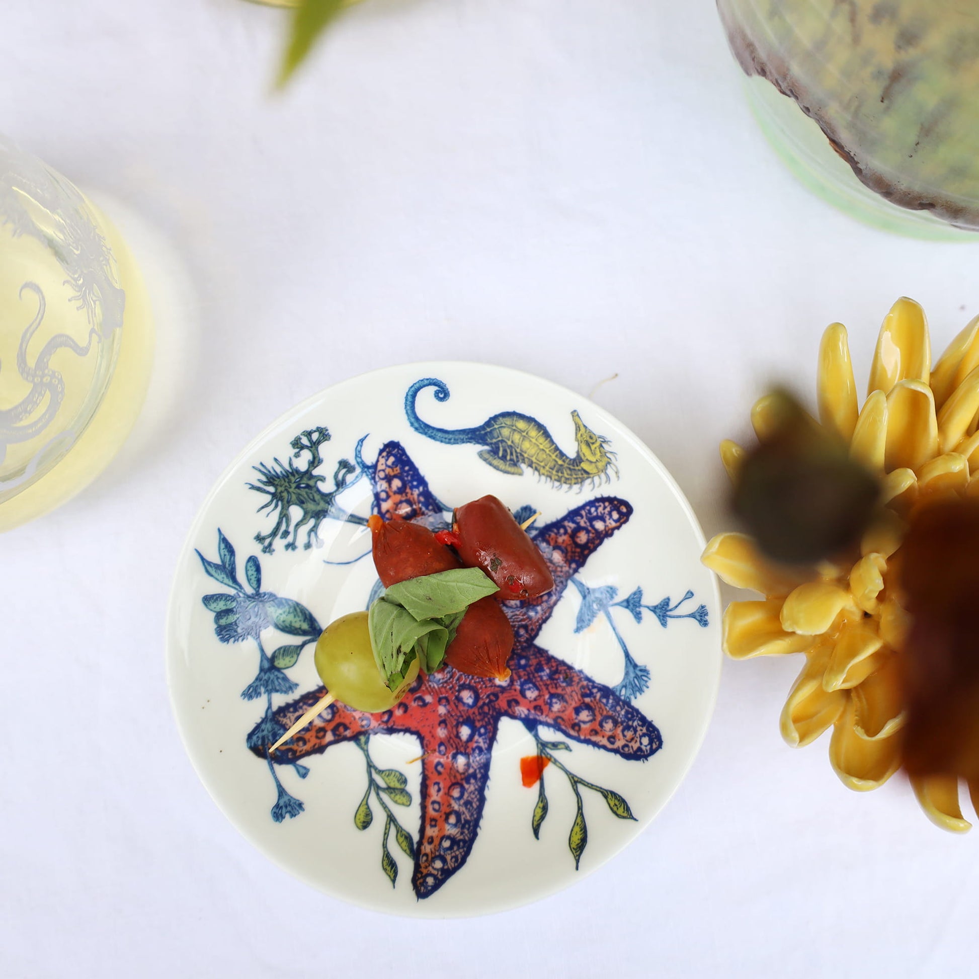 Decorative plate with a starfish design on a white surface
