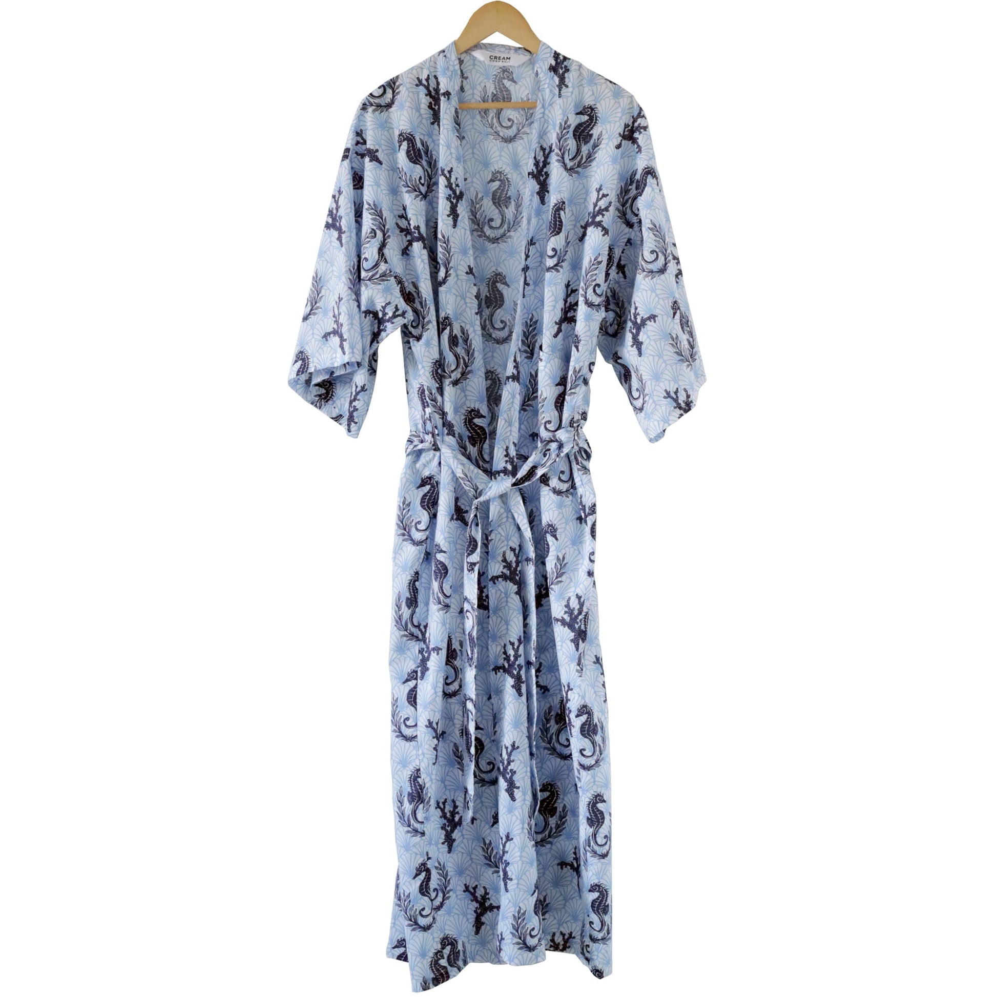 Blue patterned robe on a hanger against a white background