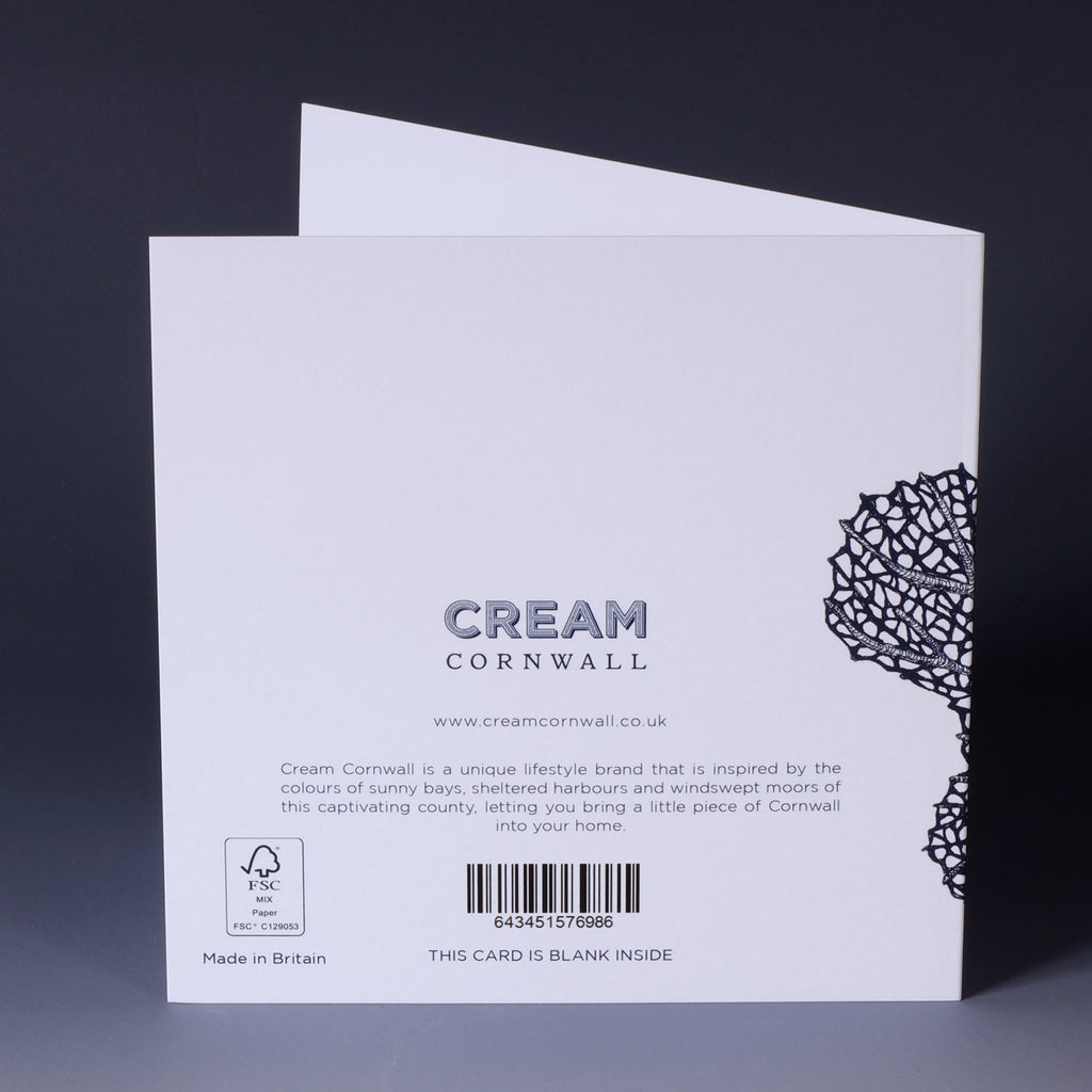 back of greeting card with navy illustration of a sea fan on a white background