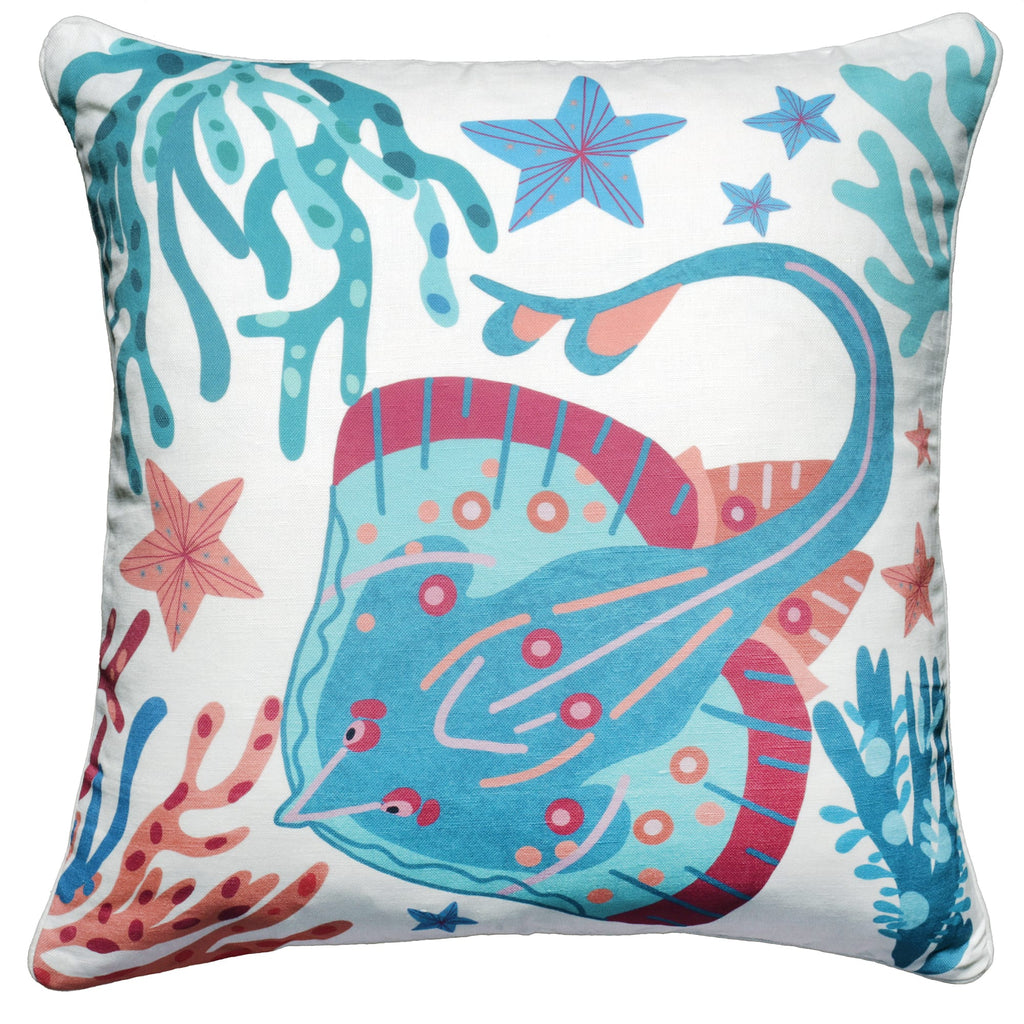 Square cushion featuring a marine-themed print with a colorful skate fish surrounded by coral, seaweed, and starfish. The design includes shades of turquoise, pink, and blue on a white background, creating a whimsical underwater scene.