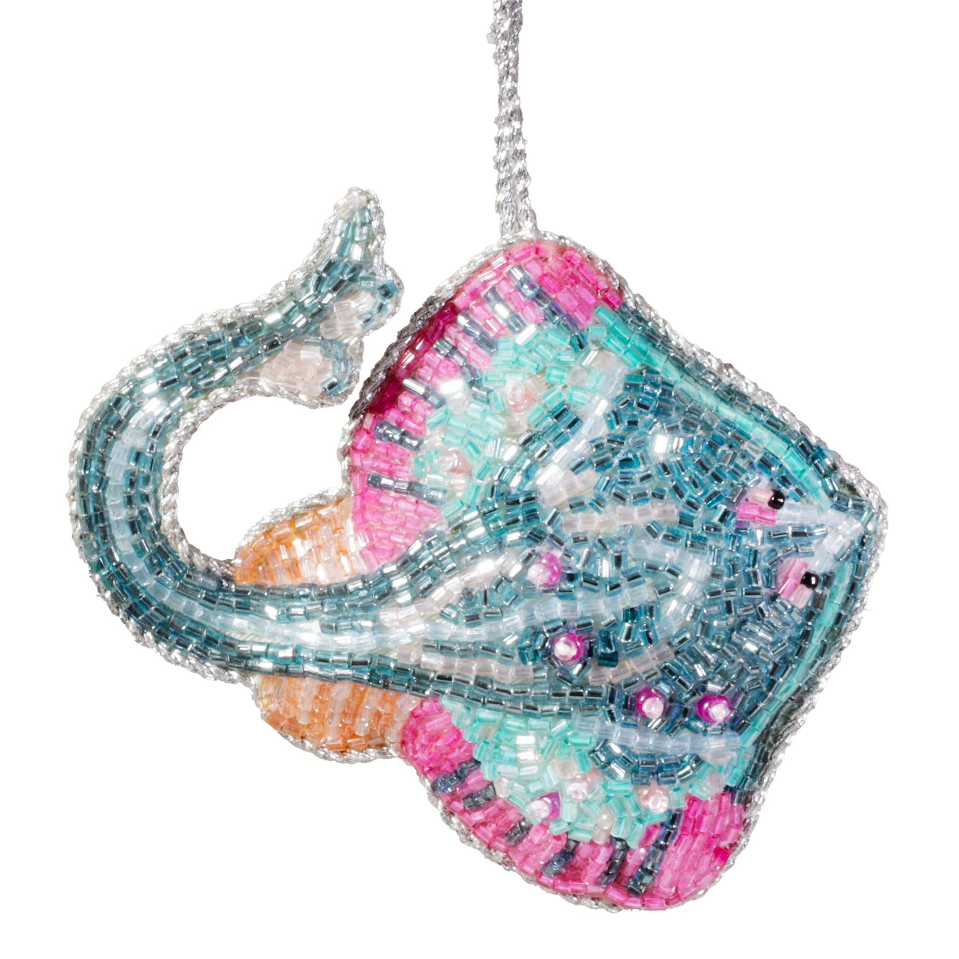 Decorative skate fish
ornament with beaded details on a white background