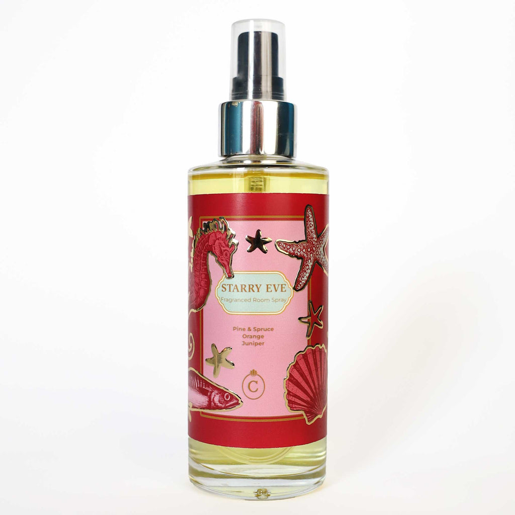 Cream Cornwall Starry Eve fragranced room spray with a red and pink sea life design, scented with pine, spruce, orange and juniper.