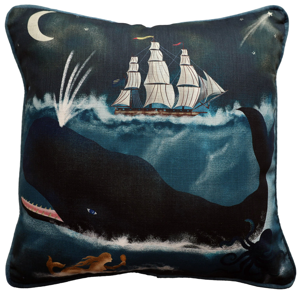 A square decorative cushion featuring a maritime-themed design. The illustration shows a large whale swimming beneath a tall ship with white sails, set against a dark ocean under a crescent moon and starry sky. The whale spouts water, while a golden mermaid swims in the lower corner and an octopus tentacle emerges from the waves. The rich blue tones and whimsical imagery evoke a sense of nautical adventure and folklore, perfect for adding a coastal touch to any space.