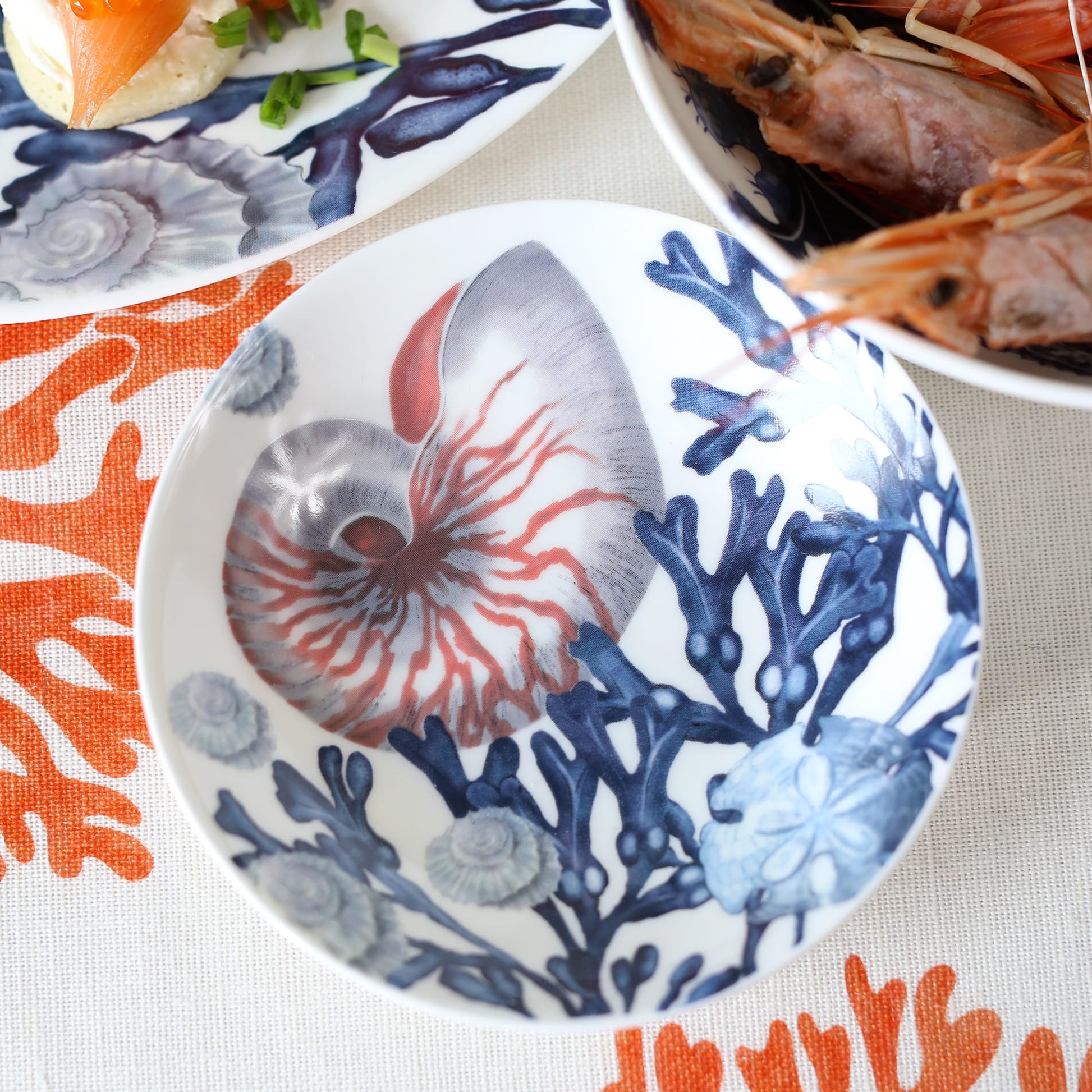 Nibbles bowl in Bone China in our Beachcomber range in Navy and white in a Nautilus,seaweed and shells design
