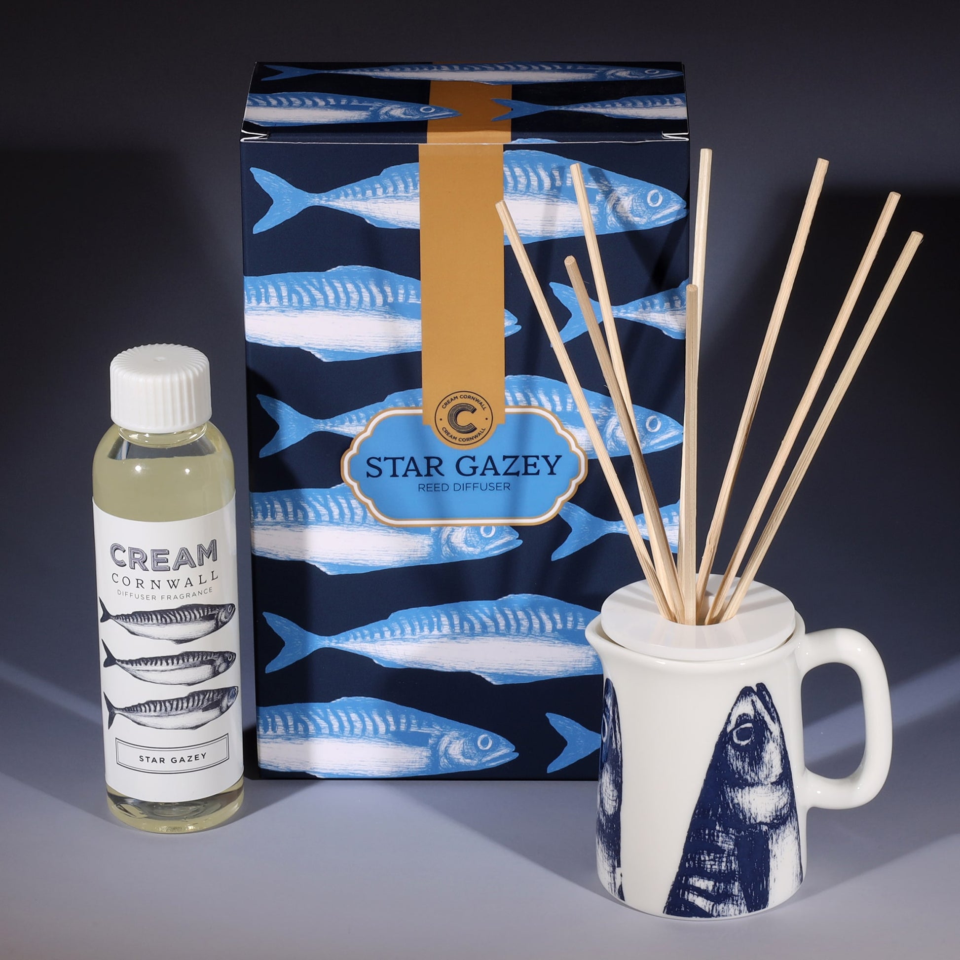 Star Gazey room diffuser with natural reeds in front of the product box and a bottle of diffuser liquid.